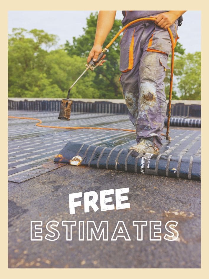 A worker torching down SBS membrane on a Calgary low-slope roof